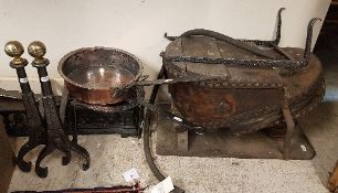 A collection of metal wares to include a pair of blacksmiths bellows, a chimney crane,