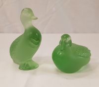 A Lalique green glass figure of a Mandarin duck and another Lalique green glass figure of a seated