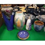 A collection of Royal Doulton vases comprising blue ground grape and vine decorated example,