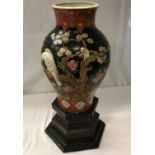 A Chinese famille-noire vase with eagle and monkey decoration, bearing marks to base,