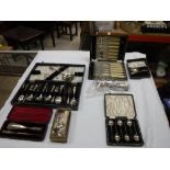 A collection of plated cutlery to include cased pusher and spoon