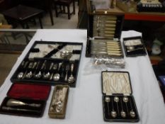 A collection of plated cutlery to include cased pusher and spoon