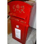 A modern vintage style red painted post box inscribed "GVI R Letters Only" Size approx 59cm high x