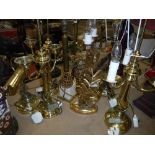 Two pairs of brass table lamps and five single table lamps