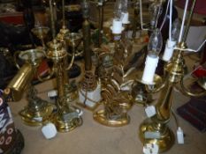 Two pairs of brass table lamps and five single table lamps