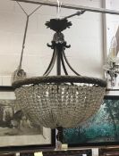 A large 19th Century French gilt bronze ceiling light of basket form strung with facetted glass