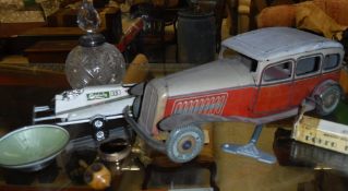 A collection of items to include an English tin plate model of a Citroen Rosalie, circa 1934,