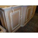 A limed beech dresser together with a set of three matching glass topped coffee tables circular