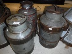 Three various galvanised / iron bound milk churns