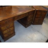 A modern burr walnut kneehole desk with tooled and gilded writing surface,
