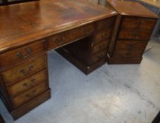 A modern burr walnut kneehole desk with tooled and gilded writing surface,