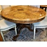 A Victorian burr walnut oval loo table on carved quadruped base together with a set of eight spoon