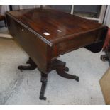 A Victorian mahogany pedestal drop-leaf Pembroke table on quadruped base to brass caps and castors