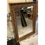 A modern carved giltwood framed wall mirror in the Rococo style Size approx.