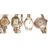 Two Omega 9 carat gold ladies wristwatches, together with two further 9 carat gold watches,
