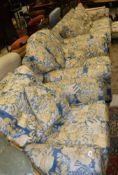 A modern blue, yellow and cream upholstered scroll arm four piece living room suite comprising sofa,