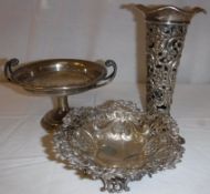 A Victorian pierced silver bonbon dish raised on a pedestal foot (by William Comyns & Sons Limited,