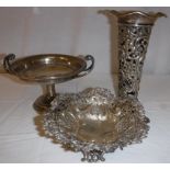 A Victorian pierced silver bonbon dish raised on a pedestal foot (by William Comyns & Sons Limited,
