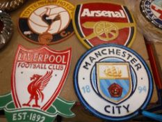 A collection of four painted metal football club signs including Liverpool, Tottenham Hotspur,