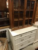 A modern white painted chest of three drawers,
