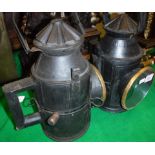 Two black painted tin and brass mounted railway lamps in the Victorian manner CONDITION