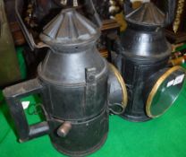 Two black painted tin and brass mounted railway lamps in the Victorian manner CONDITION