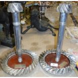 Two crown wheel and pinion candlesticks bearing labels inscribed "Marlborough Maclaren MP4 Crown