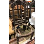 A set of six Continental 19th Century oak dining room chair frames with carved fruit decorated top