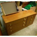 A Stag Cantata design teak dressing chest of 3 long and 3 short drawers with offset mirror back and