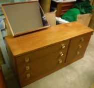 A Stag Cantata design teak dressing chest of 3 long and 3 short drawers with offset mirror back and
