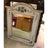 A white painted wooden framed wall mirror with applied painted white roses,