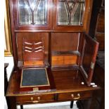 A mahogany secretaire bookcase cabinet with moulded cornice over two bevel edge cabinet doors,