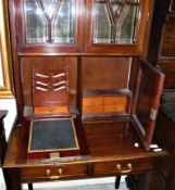 A mahogany secretaire bookcase cabinet with moulded cornice over two bevel edge cabinet doors,