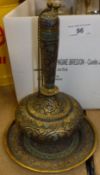 A box containing various decorative items including an Indian enamelled gilded bottle and matching