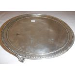A late George III silver card tray of plain form with beaded edge,