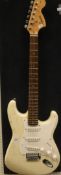 A Fender Squire Strat 6 string electric guitar,