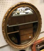 Three various modern oval gilt framed wall mirrors and a rectangular mirror