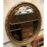 Three various modern oval gilt framed wall mirrors and a rectangular mirror