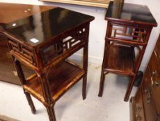 A pair of Chinese lacquered and bamboo two tier occasional tables or lamp tables,