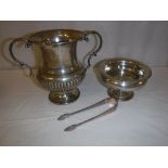 A collection of silver ware to include a twin-handled trophy cup, a small pedestal bowl,