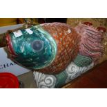 A carved and painted wooden "Siamese Fighting Fish" figure.