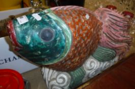 A carved and painted wooden "Siamese Fighting Fish" figure.