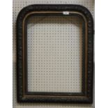 A 19th Century French ebonised arched mirror frame with floral decoration (no glass) Size approx.