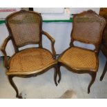 A set of six stained cane seated dining chairs in the Louis XVI taste together with a pair of near