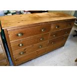 A pine bank of six drawers with brass handles Size approx 155cm long x 91cm high x 44cm deep