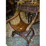 A Continental walnut framed hall chair on a shaped X stretchered base Size approx.