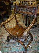 A Continental walnut framed hall chair on a shaped X stretchered base Size approx.