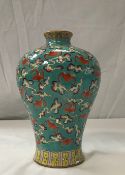 A circa 1900 Chinese Qing Dynasty Meiping style vase depicting flying bats and symbols of happiness,