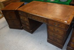 A modern burr walnut kneehole desk with tooled and gilded writing surface,