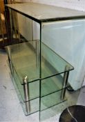 A modern three-tier glass and chrome coffee table together with a modern glass console table size